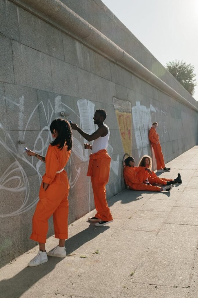 People Painting a Wall